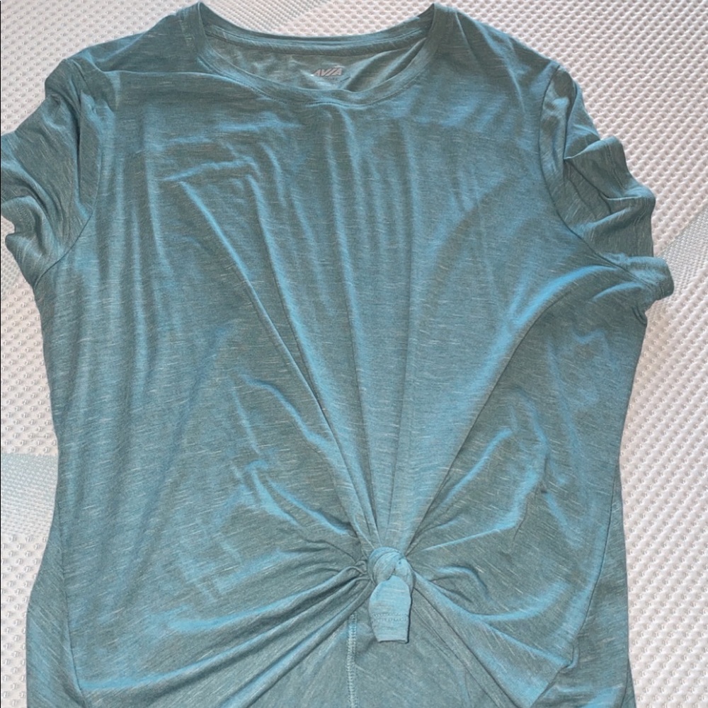 Turquoise t-shirt with tie and sewn in detail in back.super soft and like new